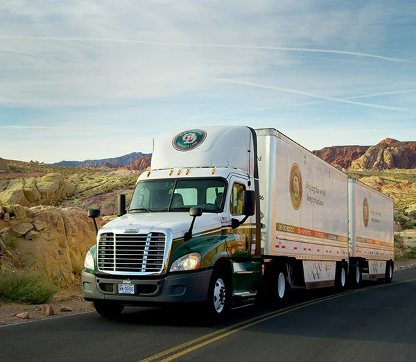 TRACTOR_DOUBLES_VALLYofFIRE_NEVADA_WINDY_ROAD_MOUNTAINS_600x522.jpg